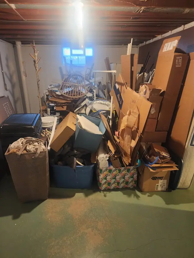 Roll-off dumpster container at job site for 4 Yard Dumpster Rental in Dennis